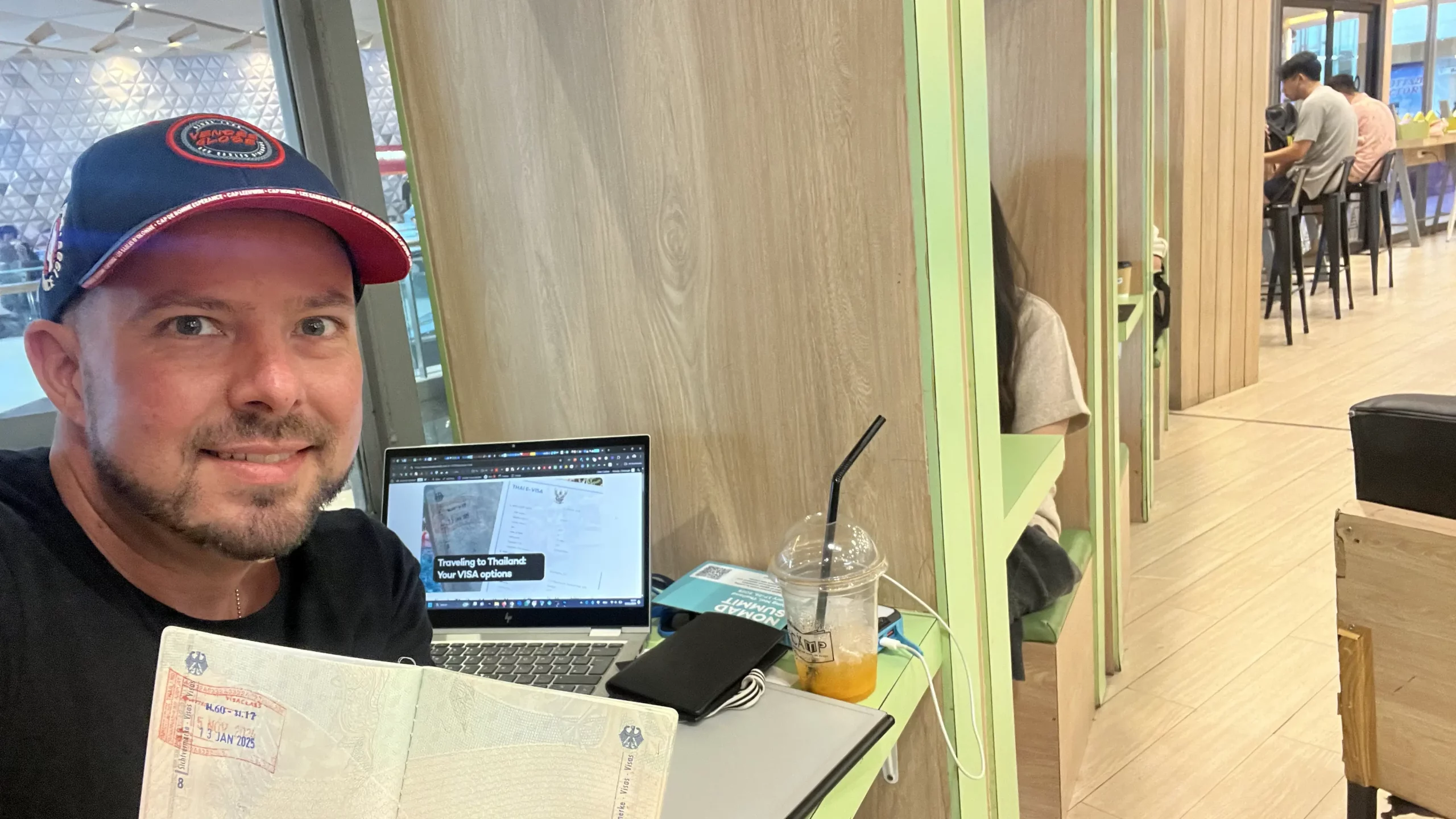 Christoph with his passport stamp at CAMP in Chiang Mai while writing this text