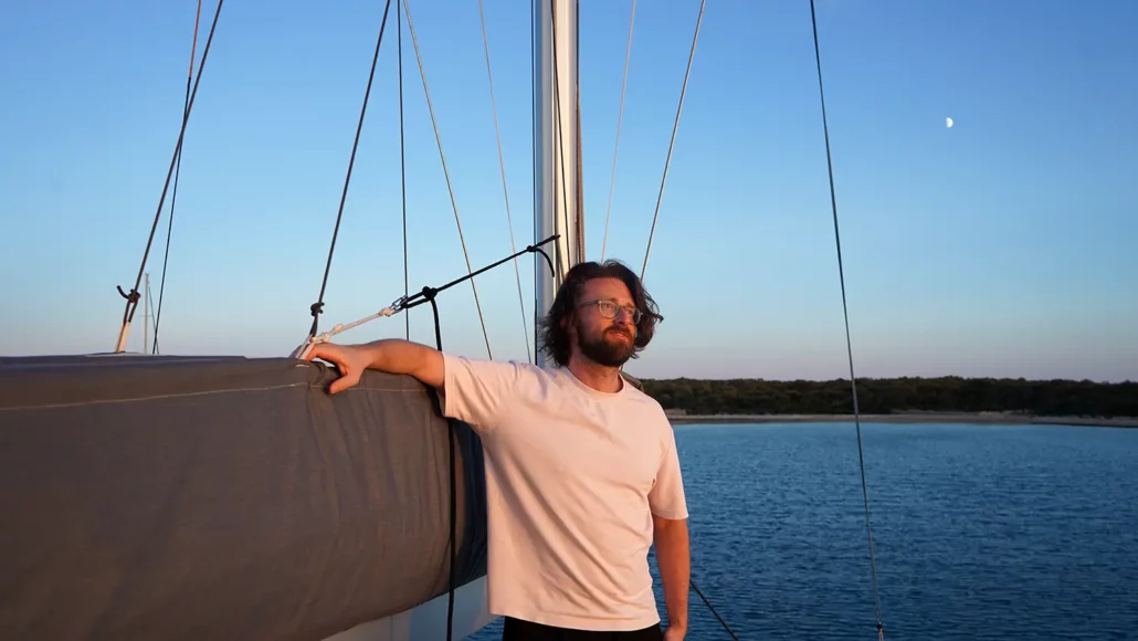 Bogdan Danchuk on the sail boat - admiring the sunset
